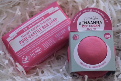 Dr Bronner's All-one Castile soap in pink wrapper; Ben & Anna deo cream in pink packaging